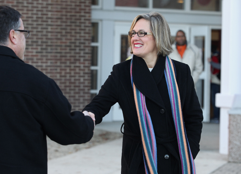 Democratic U.S. Senate candidate Cynthia Dill greets a voter Tuesday outside the polling place at Scarborough High School.