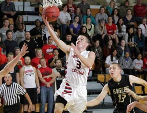 This image provided by Grinnell College shows guard Jack Taylor shooting one of 108 shots during Tuesday's game against Faith Baptist Bible in Grinnell, Iowa.