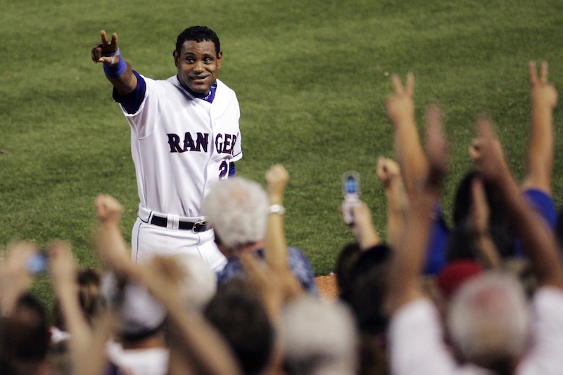 In this June 20, 2007, file photo, Texas Rangers' Sammy Sosa acknowledges cheers from fans after hitting his 600th career home run against the Chicago Cubs in a baseball game in Arlington, Texas. Sosa, Roger Clemens and Barry Bonds are set to show up on the Hall of Fame ballot for the first time on Wednesday, Nov. 28, 2012, and fans will soon find out whether drug allegations block the former stars from reaching baseball's shrine. (AP Photo/Tim Sharp, File)