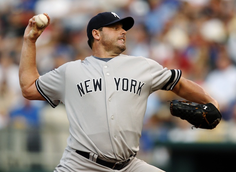 In this July 23, 2007, file photo, New York Yankees starting pitcher Roger Clemens throws against Kansas City Royals' David DeJesus in the first inning of a baseball game in Kansas City, Mo. Clemens, Barry Bonds and Sammy Sosa are set to show up on the Hall of Fame ballot for the first time on Wednesday, Nov. 28, 2012, and fans will soon find out whether drug allegations block the former stars from reaching baseball's shrine. (AP Photo/Ed Zurga, File)