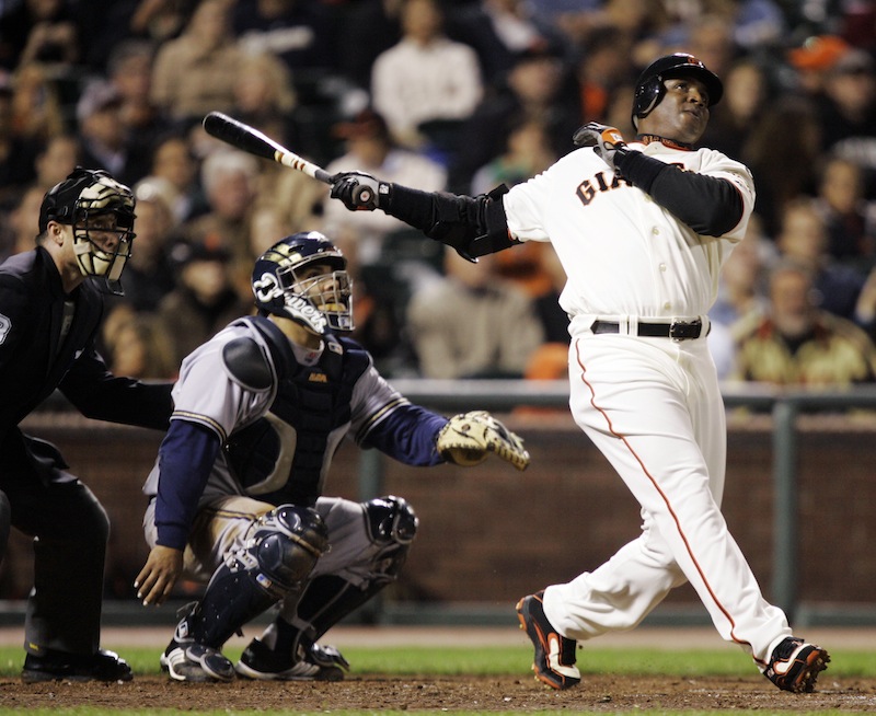 In this Aug. 24, 2007, file photo, San Francisco Giants' Barry Bonds, right, hits his 761st career home run, a solo effort, off Milwaukee Brewers pitcher Chris Capuano in the fourth inning of a baseball game in San Francisco. Bonds, Roger Clemens and Sammy Sosa are set to show up on the Hall of Fame ballot for the first time on Wednesday, Nov. 28, 2012, and fans will soon find out whether drug allegations block the former stars from reaching baseball's shrine. (AP Photo/Marcio Jose Sanchez, File)