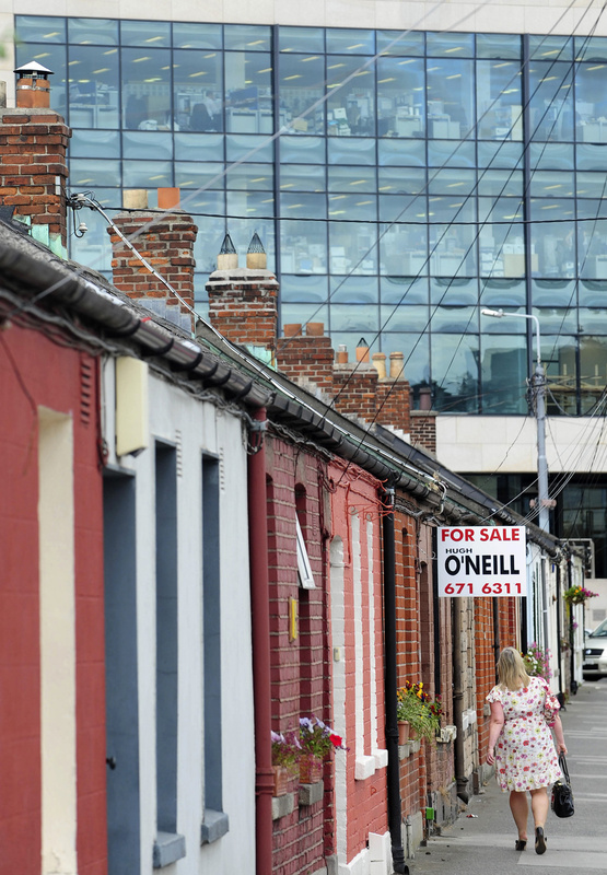 A row of cottages in Dublin in 2011. “I’m not calling any massive recovery, but people are going to look back and see a lot of missed opportunities in Ireland if they had the cash,” says the head of one property broker.