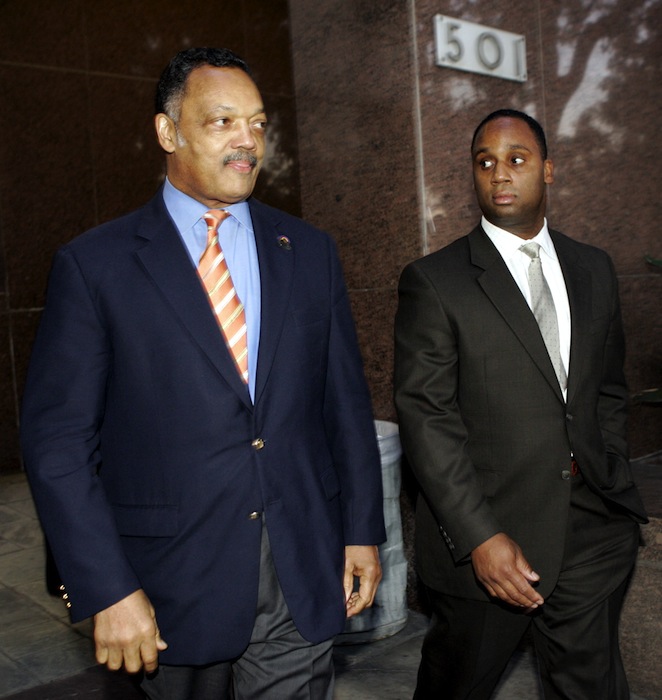 In this Jan. 19, 2006 The Rev. Jesse Jackson, left, and his son Jonathan leave Los Angeles Superior Court. At 71, Jackson Sr. still keeps a hectic schedule and speaks extemporaneously on civil rights issues of all kinds. But he struggles when addressing one thing: Jesse Jackson Jr., the son and heir to Jackson’s political influence who abandoned his congressional seat last week because of mental health problems and two federal investigations. Jonathan Jackson, a Chicago State University business professor, is contemplating seeking the congressional seat vacated by Jesse Jr. (AP Photo/Ric Francis, File)