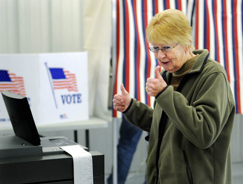 THUMBS UP: Joan Billings reacts to casting her ballot Tuesday at the polling place within the West Gardiner Fire Department.