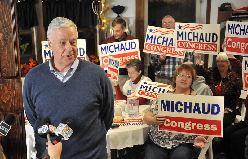 Staff photo by Michael G. Seamans Mike Michaud speaks to supporters after winning another term as the representative from the 2nd Congressional District during a campaign party at Grass Roots Cafe and Catering on Main Street in East Millinocket on Tuesday.