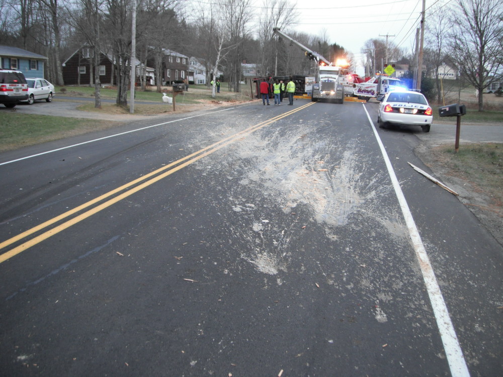 About 15 cubic yards of a mix of waste raw chicken parts and processed chicken in liquid discharged from a truck that rolled over in Gorham on Tuesday, Nov. 27, 2012. The waste landed on the roadway, residential lawns and driveways.