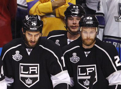 Los Angeles King players Dwight King, left, Dustin Brown and Trevor Lewis. The NHL announced Friday that it has canceled all games through through Dec. 14 because of the labor dispute between owners and players.