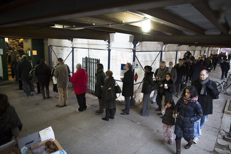Voters wait for their chance to cast a ballot at P.S. 29 in the Cobble Hill neighborhood of Brooklyn Tuesday. Some voters in New York and New Jersey expressed elation at being able to vote at all after the disruption of superstorm Sandy.