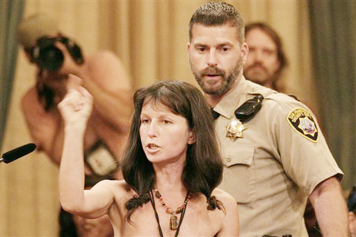Protester Gypsy Taub speaks out against the Board of Supervisors decision to ban public nakedness at City Hall in San Francisco on Tuesday. The nudist activist who organized naked protests and marches in the weeks leading up to Tuesday's meeting, disrobed in protest before sheriff's deputies escorted her from the room.