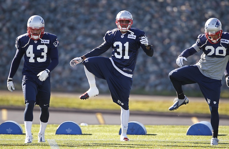 Newly acquired New England Patriots cornerback Aqib Talib (31) stretches with defensive back Nate Ebner (43) and safety Steve Gregory (28) during practice at the NFL team's facility in Foxborough, Mass., Wednesday, Nov. 14, 2012. (AP Photo/Stephan Savoia) Gillette Stadium