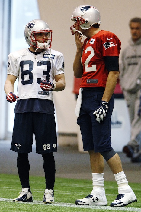 New England Patriots wide receiver Wes Welker (83) talks with quarterback Tom Brady (12) during practice at the NFL football team's facility in Foxborough, Mass., Wednesday, Nov. 7, 2012. (AP Photo/Stephan Savoia)