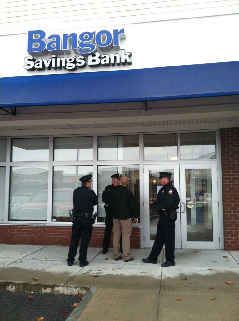 Portland Police arrived on the scene Tuesday morning after someone robbed the Bangor Savings Bank branch at Pine Tree Shopping Center on Brighton Avenue.