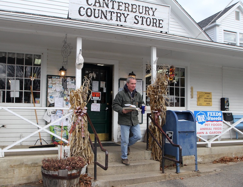 Kevin Brags leaves the Canterbury Country Store after buying his coffee and Powerball ticket, Wednesday, Nov. 28, 2012 in Canterbury, N.H. (AP Photo/Jim Cole)