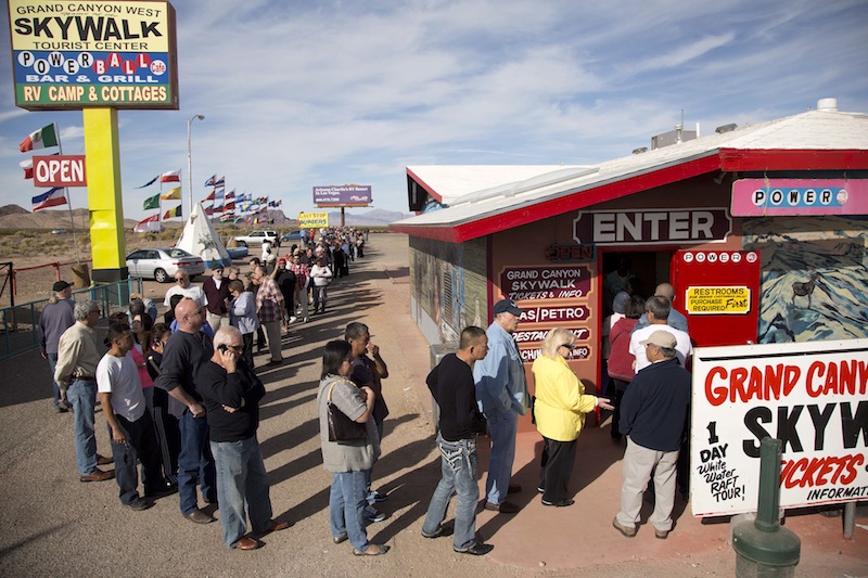 A crowd of people line up outside the Arizona Last Stop convenience store and souvenir shop to buy Powerball tickets, Tuesday, Nov. 27, 2012, in White Hills, Ariz. There has been no Powerball winner since Oct. 6, and the jackpot already has reached a record level for the game. Already over $500 million, it is the second-highest jackpot in lottery history, behind only the $656 million Mega Millions prize in March. (AP Photo/Julie Jacobson)