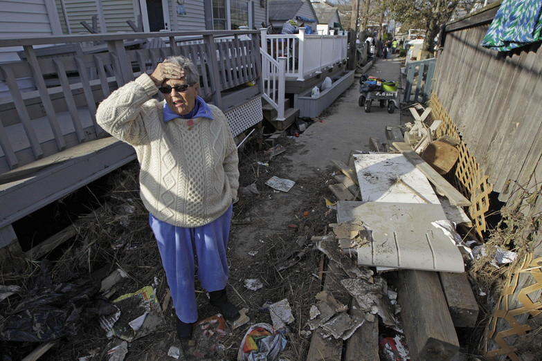Ginny Flanagan, 70, returns to her damaged home and destroyed neighborhood in Breezy Point on Sunday for the first time in the wake of Superstorm Sandy.