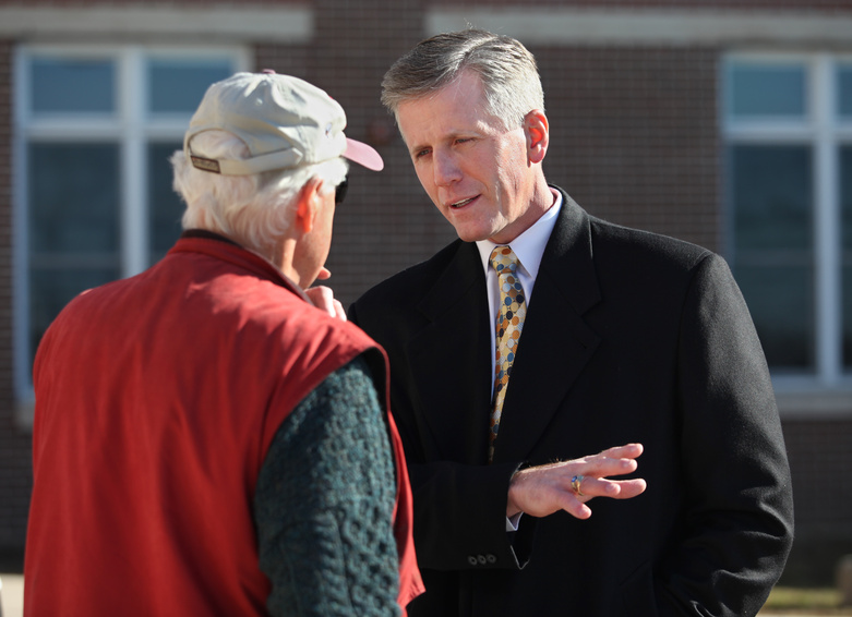 Republican U.S. Senate candidate Charlie Summers, right, speaks with Tom Skolfield Tuesday at the polling place at Scarborough High School.