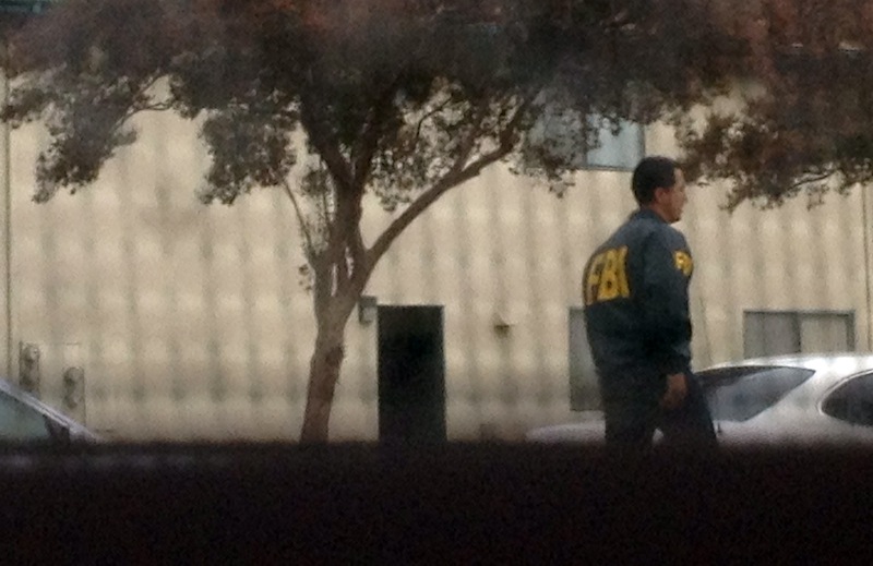 This provided photo taken Friday, Nov. 16, 2012, by Jenny Collins from her neighbor's window shows law enforcement and FBI agents during a raid at the home of 21-year-old Miguel Alejandro Santana Vidriales of Upland, Calif. Santana was one of four Southern California men charged with plotting to kill Americans and destroy U.S. targets overseas by joining al-Qaida and the Taliban in Afghanistan, federal officials said Monday. In one online conversation, Santana told an FBI undercover agent that he wanted to commit jihad and expressed interest in a jihadist training camp in Jalalabad, Afghanistan. (AP Photo/Jenny Collins)