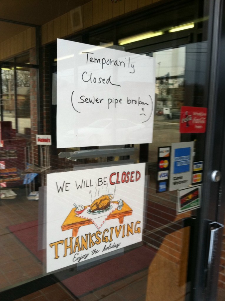 A sign on the door of the Wok Inn on Forest Avenue in Portland on Tuesday informed customers the restaurant was closed because of a sewer pipe issue.