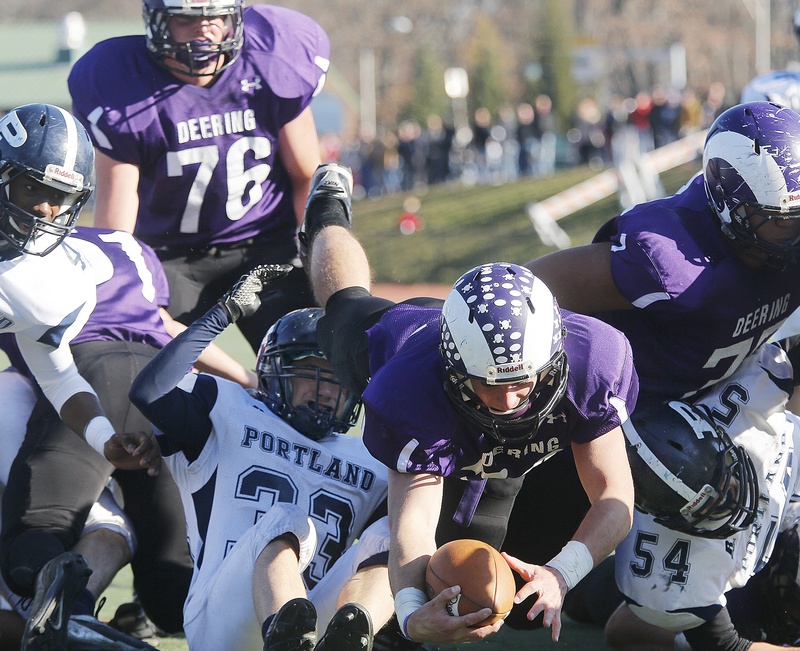 Ken Sweet of Deering dives to score during the first quarter in the Thanksgiving Day football game with Portland High School.
