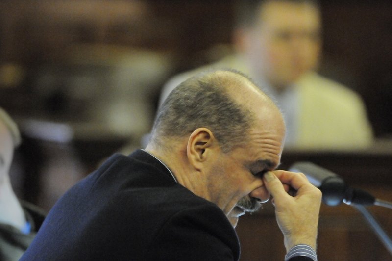 Randall Hofland of Searsport listens as Justice Jeffrey Hjelm reads the dozens charges against him in January 2011.