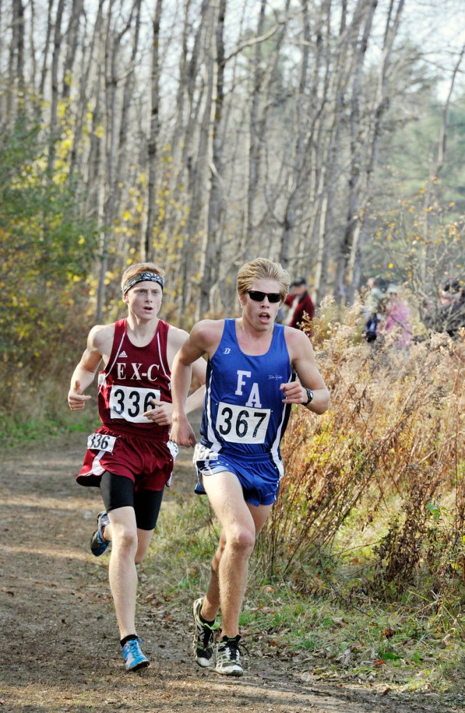 Ellsworth's Dan Curts keeps pace with Fryeburg Academy's Silas Eastman at the state championships in Belfast on Oct. 27.