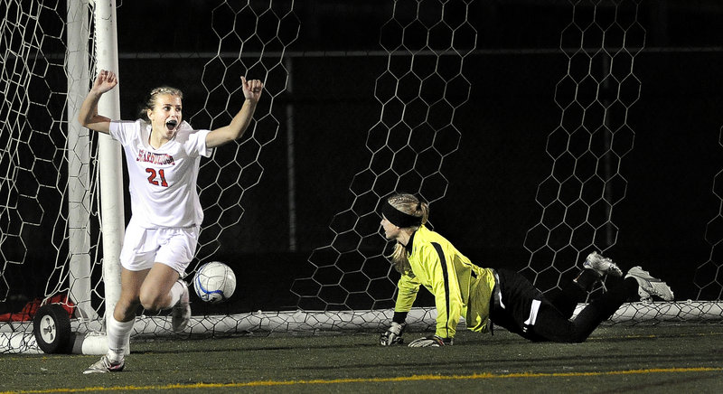 Katherine Kirk celebrates the only goal in Wednesday’s match, scored by Sarah Martens in the 65th minute of the Western Class A girls’ soccer final. The ball was just out of reach of the Capers’ keeper Mary Perkins.
