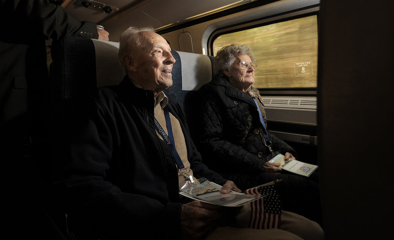 Nelson Soule, 92, of Cumberland, rides the Amtrak Downeaster with his wife, Margaret, as it makes its inaugural run north of Portland to Freeport and Brunswick on Thursday.