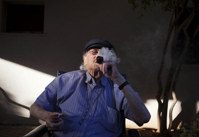 Moshe Rute, 80, smokes medical cannabis at the Hadarim nursing home in kibbutz Naan. Marijuana is illegal in Israel but medical use has been permitted since the early 1990s.