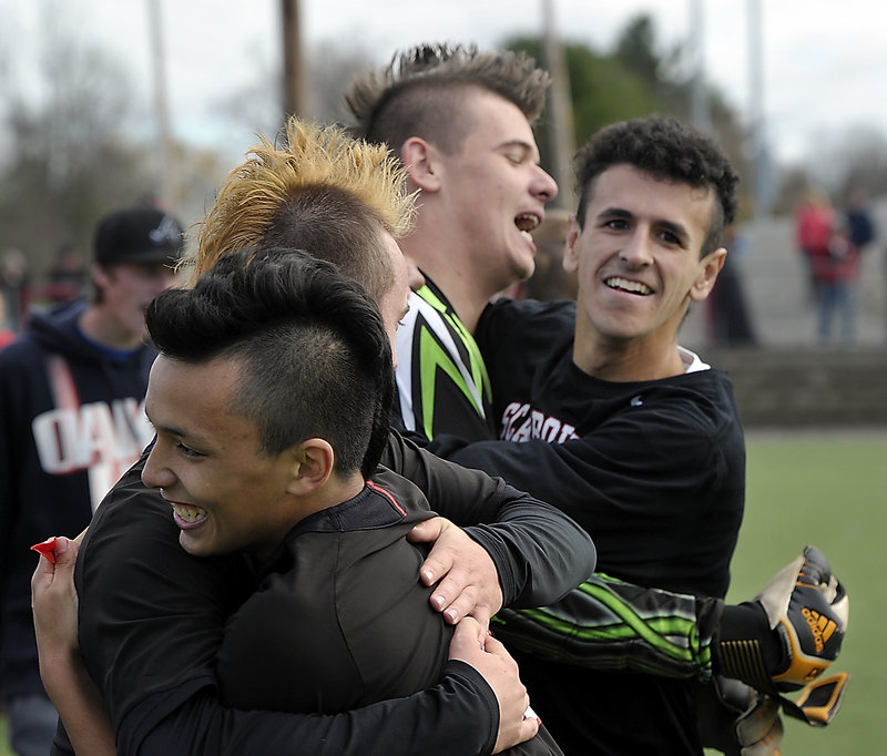 Patrick Stanton, center, posted his 10th shutout of the season Saturday as Scarborough beat Mt. Ararat 4-0 in the Class A championship game at Hampden.