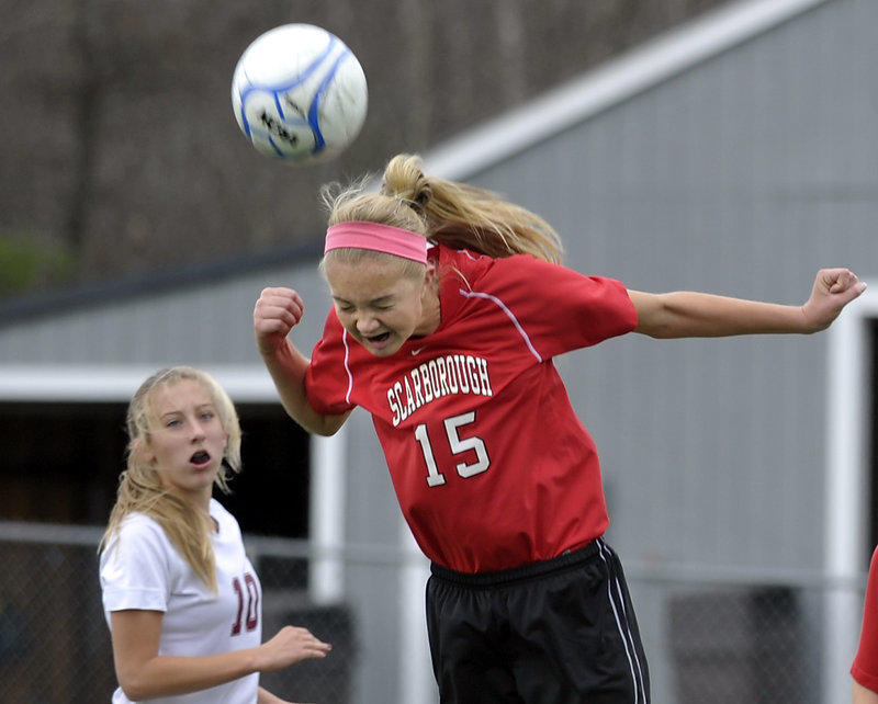 Ainsley Jamieson of Scarborough plays a header during the Class A girls’ soccer championship game against Bangor. Scarborough won 2-1 in overtime, avenging a loss to the Rams in last year’s state final.