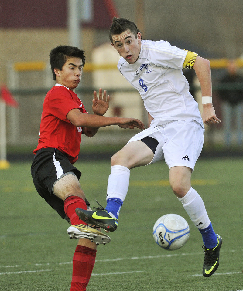 Cooper Lycan, right, of Falmouth plays the ball in front of Camden Hills’ Tristan Fong during the Class B boys’ soccer final Saturday. Falmouth fell behind early in the second half but quickly regrouped, defeating the Windjammers for the second year in a row, 2-1.