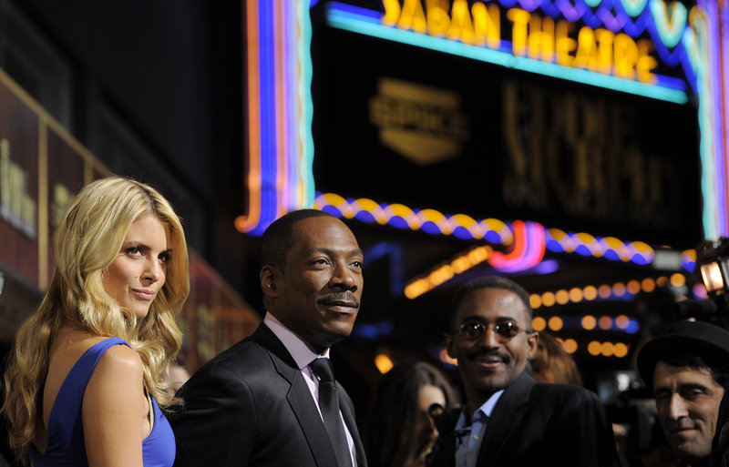 Eddie Murphy, second from left, arrives with his date, Paige Butcher, at the Saban Theatre for Spike TV’s tribute to Murphy on Saturday in Beverly Hills, Calif.