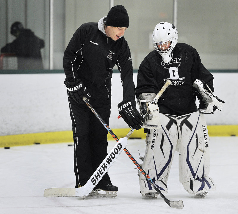 Greely Coach Nate Guerin instructs Maura Perry, a sophomore who’ll take over as the Rangers’ starting goalie after the graduation of Emma Seymour.