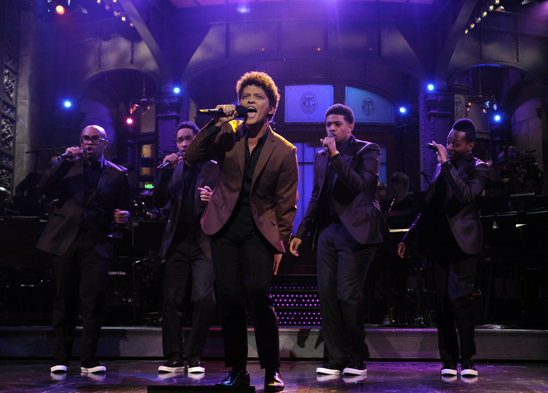 Bruno Mars performs as guest host on “Saturday Night Live” on Oct. 20. He pledged that in the future, “Whatever they need from me, they can get.”