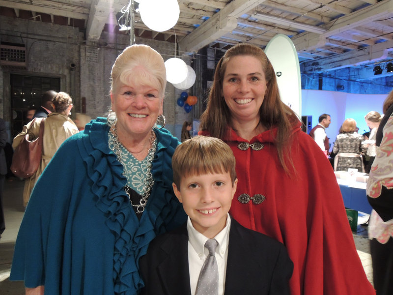 Eight-year-old Matthew Gilbert (foreground), who won the John Ford Regatta for new sailors in August, with his grandmother Jan Robinson of Boston and mother Lisa Gilbert of Cumberland. Matthew followed in the footsteps of his older brother, Joseph Gilbert, who was the winner in 2011.