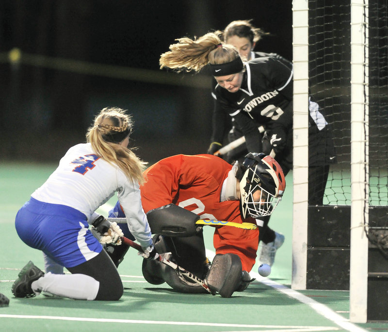 Cathleen Smith (9) slips the ball behind SUNY-New Paltz goalkeeper Antonija Pjetri to put Bowdoin up 4-0 en route to Wednesday’s 6-1 victory in the first round of the NCAA Division III field hockey tournament in Brunswick.