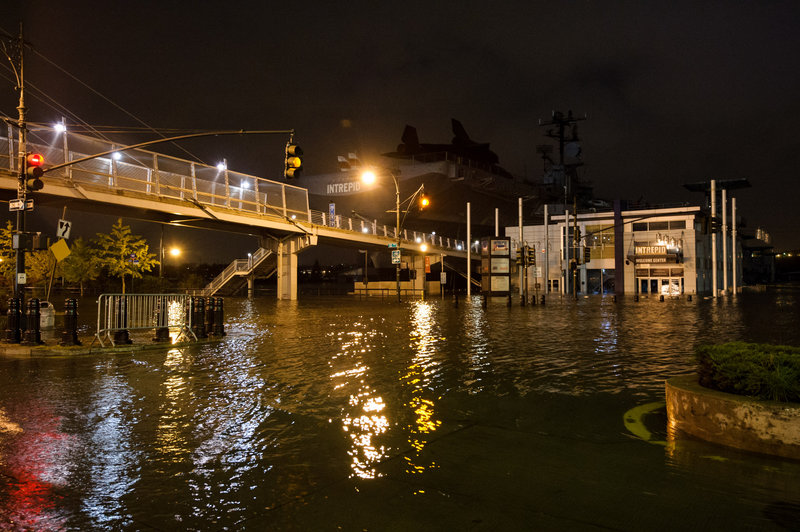 Superstorm Sandy floods Manhattan’s West Side Highway on Oct. 29. Both Sandy and last summer’s “extraordinary weather events” should jump-start a national discussion on preventing climate change, a reader says.
