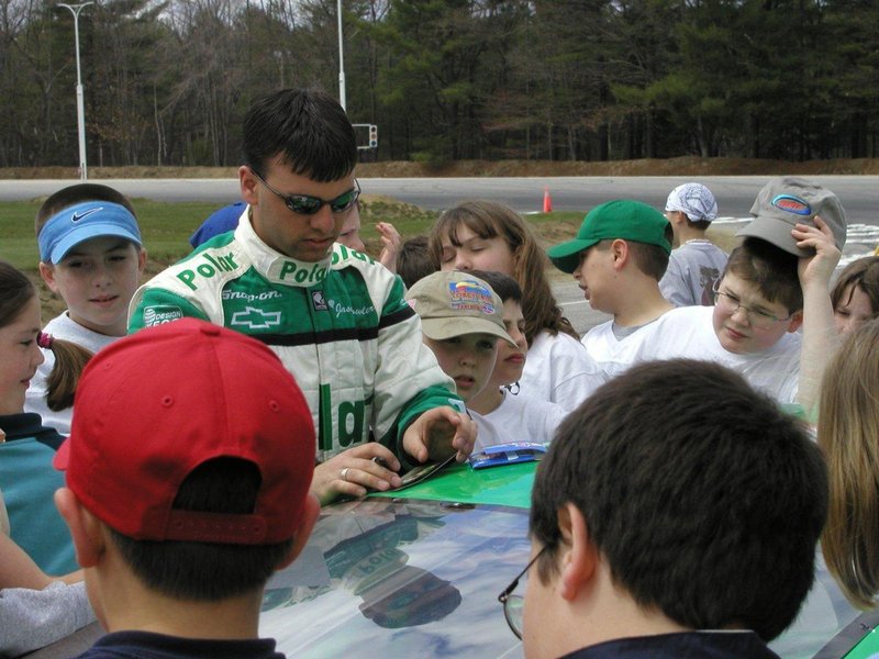 Jason Fowler signs autographs for young fans in this photo taken about 10 years ago. Fowler “always would put a smile on someone’s face,” a friend wrote on his Facebook page.
