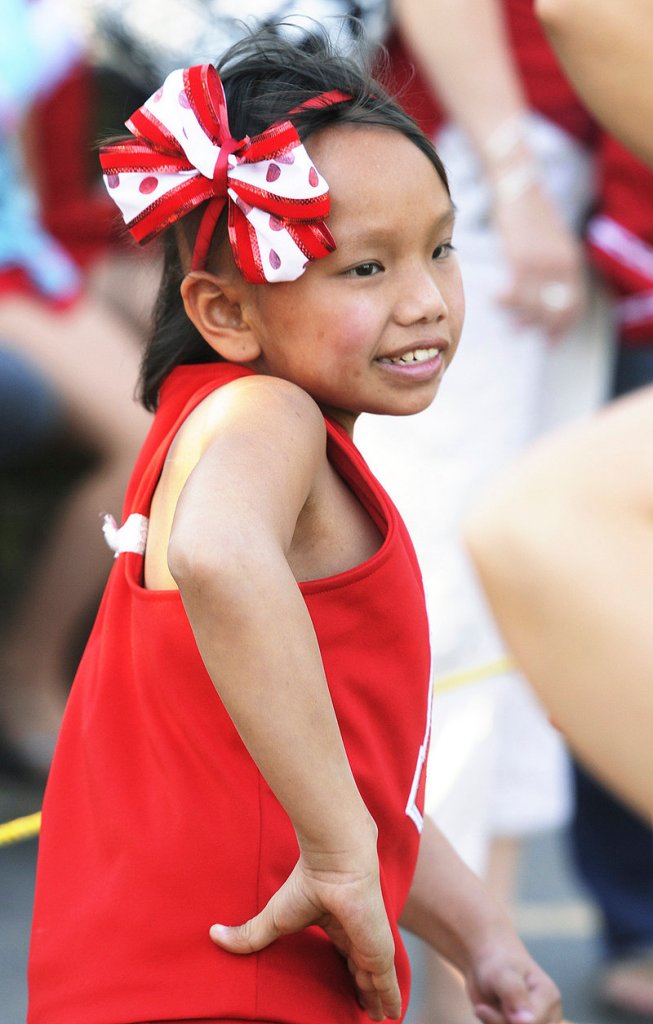 Zoe McMorran cheers on the sidelines of a North Attleboro Junior Football game last month.