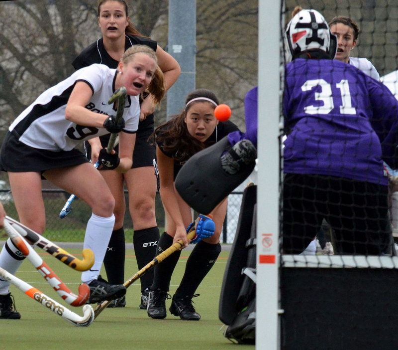 Cathleen Smith of Bowdoin sends a shot toward MIT goalie during the first half of Saturday’s NCAA tournament game in Geneva, N.Y. Smith later scored one of Bowdoin’s three first-half goals in a 3-1 win.