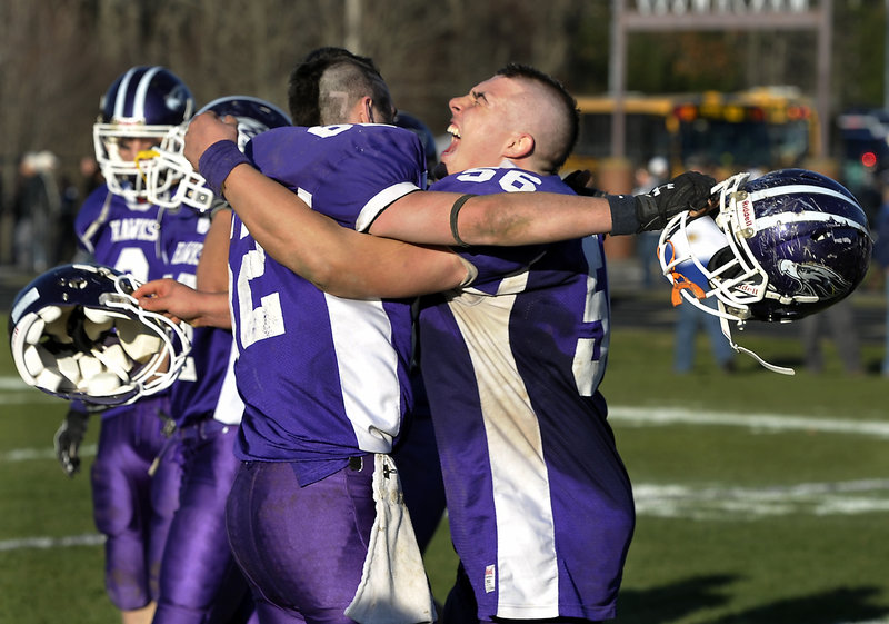 Tyler Gagnon gives a yell and a hug Saturday, embracing Ethan Joy after Marshwood beat York to win Western Class B.