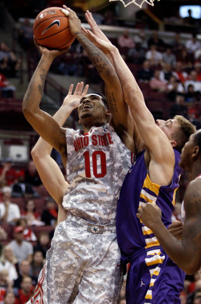 LaQuinton Ross of Ohio State goes up for a shot against Albany’s Dave Wiegmann during the Buckeyes’ season-opening win Sunday.