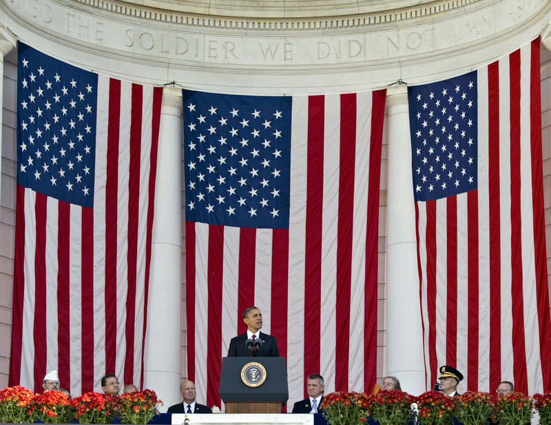 President Obama speaks during a Veterans Day ceremony at the Arlington National Cemetery Amphitheater.