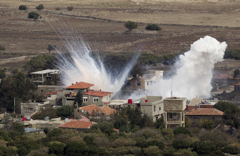 Smoke rises after shells fired by the Syrian army explode in the Syrian village of Bariqa. Israel said “Syrian mobile artillery” was hit after Israel responded to stray mortar fire.
