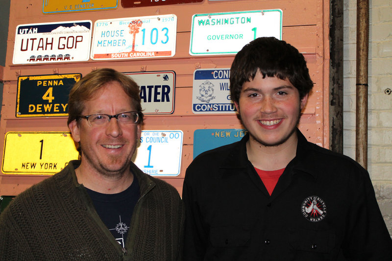 Al Zullo, co-founder of Community Bicycle Center and current volunteer, and Matt Perkins, eighth-grader and longtime volunteer at the CBC.