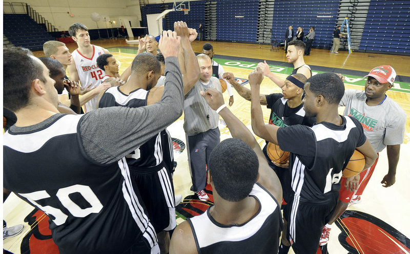 Mike Taylor, coach of the Maine Red Claws, brings his team together Tuesday during media day at the Portland Expo. The team started camp Monday and will open its NBA D-League schedule Friday, Nov. 23 at Canton. The home opener is Nov. 30 against Los Angeles.