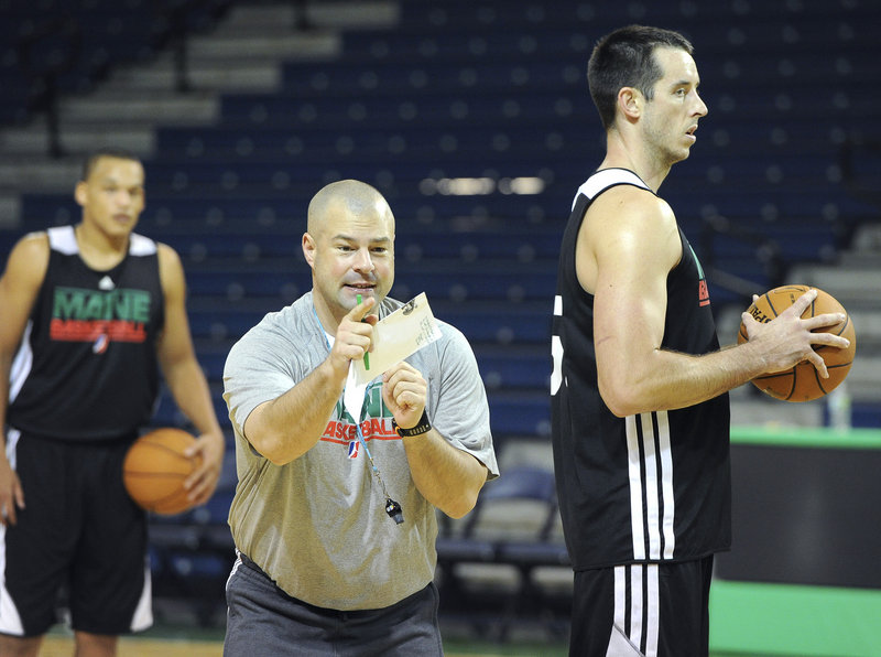 Mike Taylor provides some instruction to the Red Claws on Tuesday. The first-year Maine coach replaces Dave Leitao.