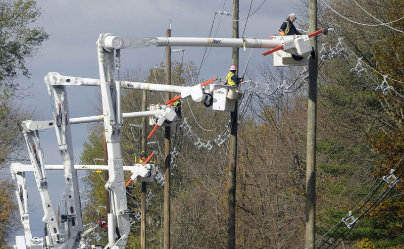 In the aftermath of Hurricane Sandy, utility crews from the St. Louis-based Ameren Corp. restring power lines in Hopewell Township, N.J., on Nov. 3. A terrorist attack would be more devastating, targeting vital equipment, a report warns.