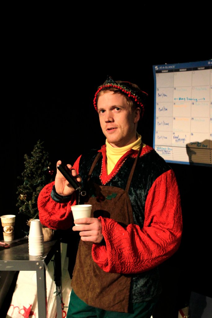 Dustin Tucker as the cynical elf Crumpet in the Portland Stage production of “The Santaland Diaries” by David Sedaris.