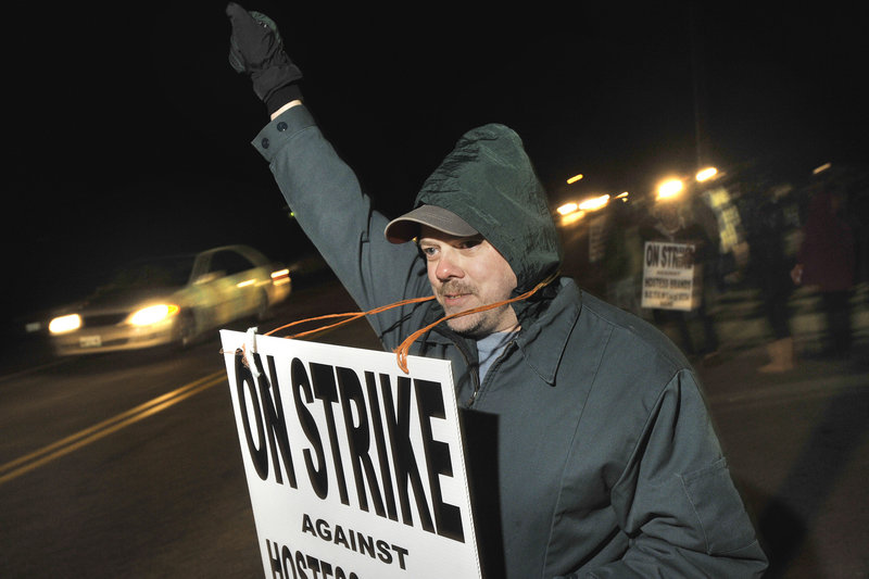 Hostess Brand workers in Biddeford ignored a Thursday deadline to return to work. Dale Dewitt, of Gorham, mans the picket line along with his fellow workers.